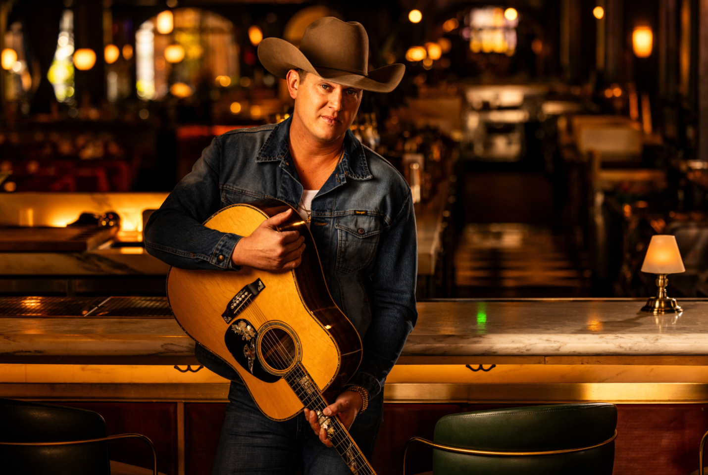 Musician Jon Pardi holding a guitar